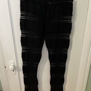 Black Givenchy leggings with see through panels.